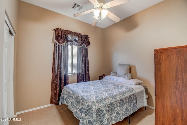 bedroom with carpet flooring, ceiling fan, and a closet