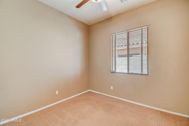 spare room with carpet and ceiling fan