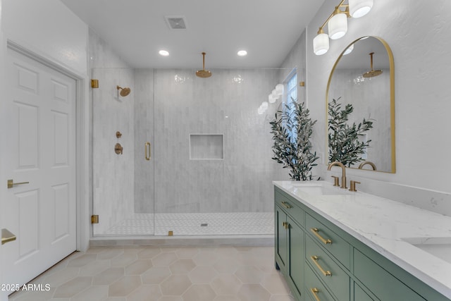 bathroom featuring an enclosed shower, vanity, and tile patterned floors