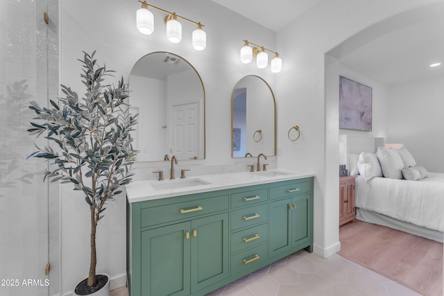 bathroom featuring tile patterned floors and vanity