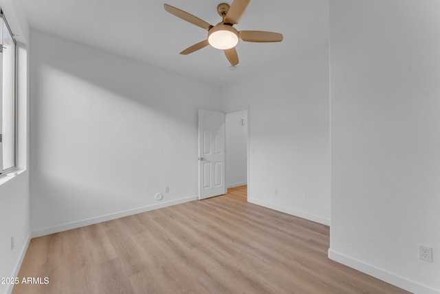 spare room featuring ceiling fan and light hardwood / wood-style flooring