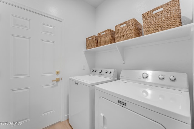 laundry room featuring washing machine and dryer