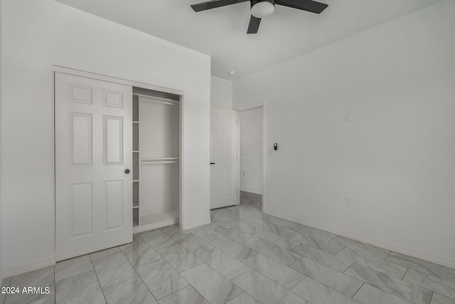 unfurnished bedroom with ceiling fan, a closet, and light tile patterned floors