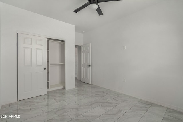 unfurnished bedroom with ceiling fan, a closet, and light tile patterned floors