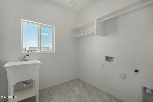 laundry room with electric dryer hookup, light tile patterned flooring, and washer hookup