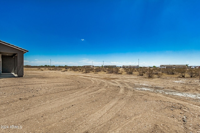 view of yard with a rural view