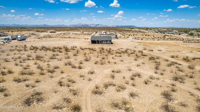 birds eye view of property featuring a mountain view