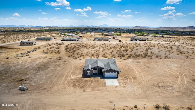 birds eye view of property featuring a mountain view