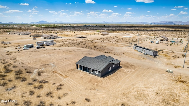 birds eye view of property with a mountain view