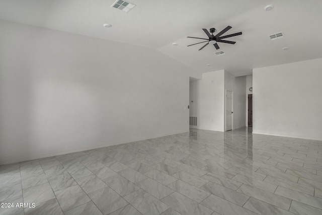 spare room featuring light tile patterned flooring, lofted ceiling, and ceiling fan