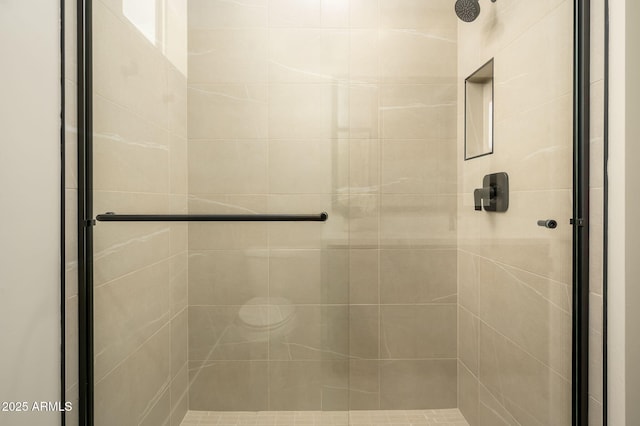 bathroom featuring a shower stall