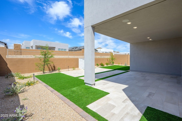 view of yard featuring a fenced backyard and a patio area