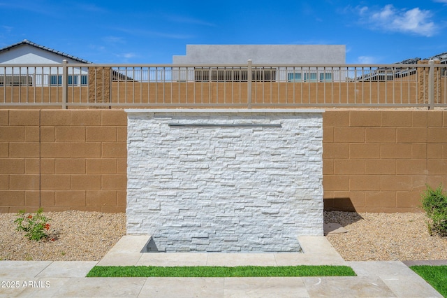 view of property's community featuring fence