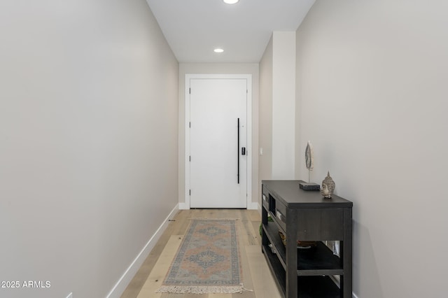 entryway featuring recessed lighting, baseboards, and light wood-type flooring