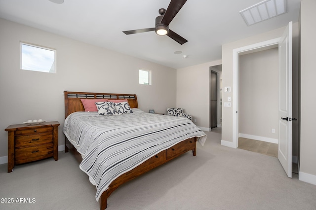 bedroom with a ceiling fan, baseboards, visible vents, and light carpet