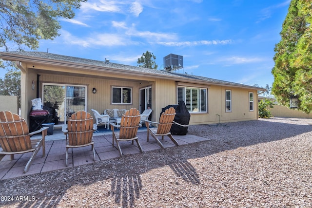 rear view of property featuring a patio and central AC unit