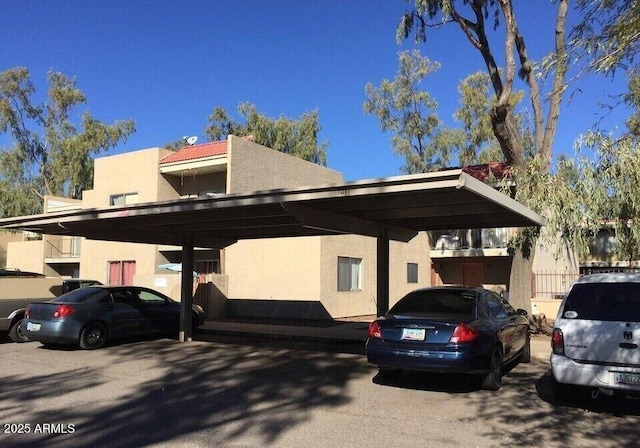 view of side of property with a carport