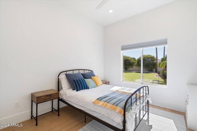 bedroom featuring light hardwood / wood-style flooring and ceiling fan