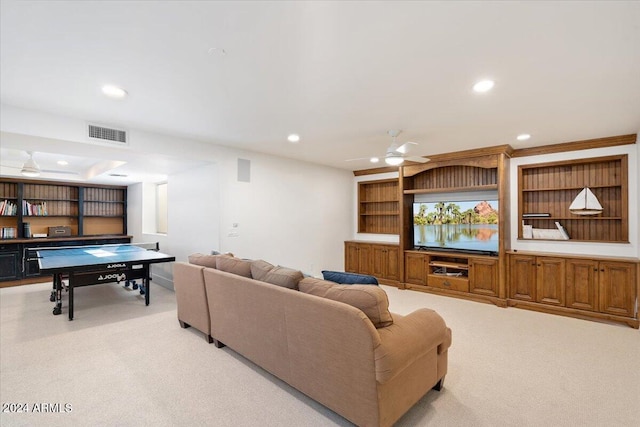 living room with ceiling fan and light colored carpet