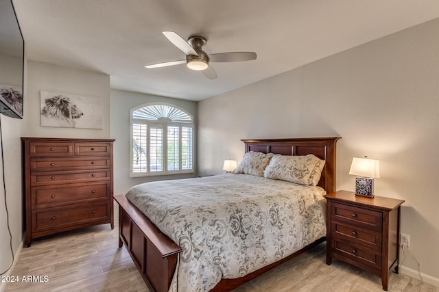 bedroom with ceiling fan and light wood-type flooring