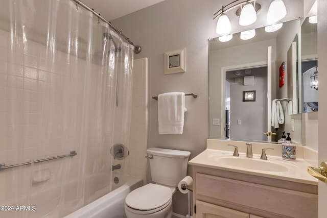 full bathroom with shower / bath combo, vanity, and toilet