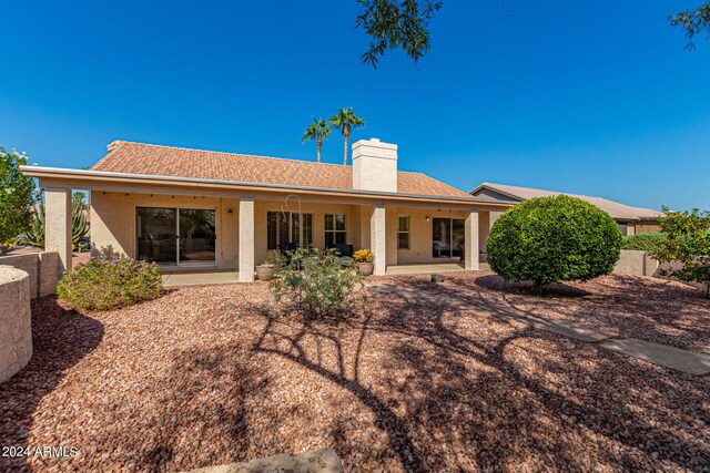 rear view of house with a patio