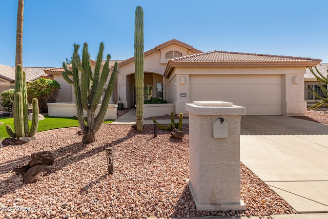 view of front of property with a garage