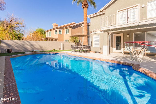 view of pool featuring a patio