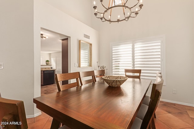 tiled dining space with a notable chandelier