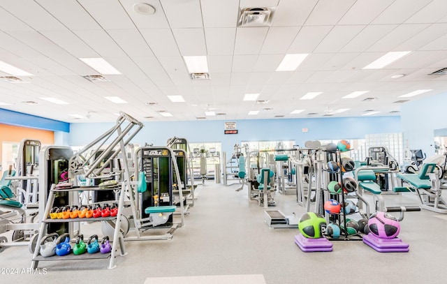 workout area featuring a paneled ceiling