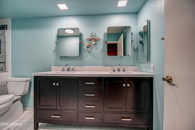 bathroom featuring tile floors, dual bowl vanity, and toilet