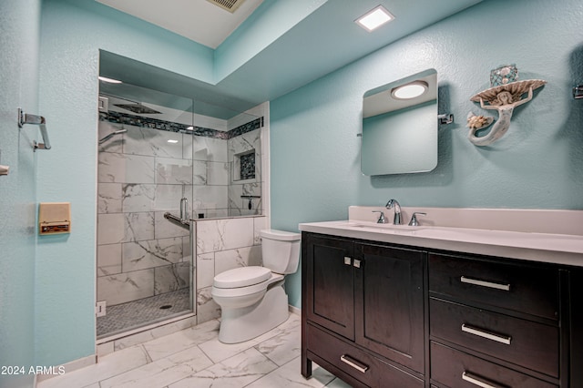 bathroom featuring walk in shower, vanity, toilet, and tile floors