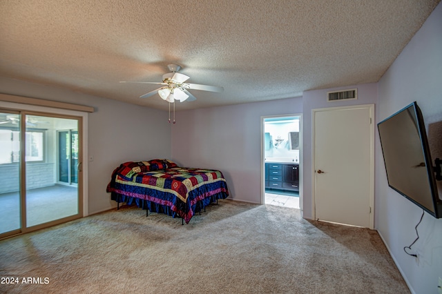 bedroom with access to outside, a textured ceiling, carpet, and ceiling fan