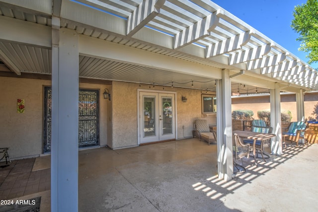 view of patio featuring a pergola and french doors