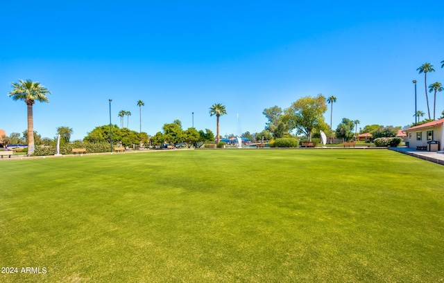 view of home's community featuring a lawn