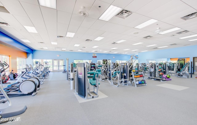 workout area featuring a paneled ceiling