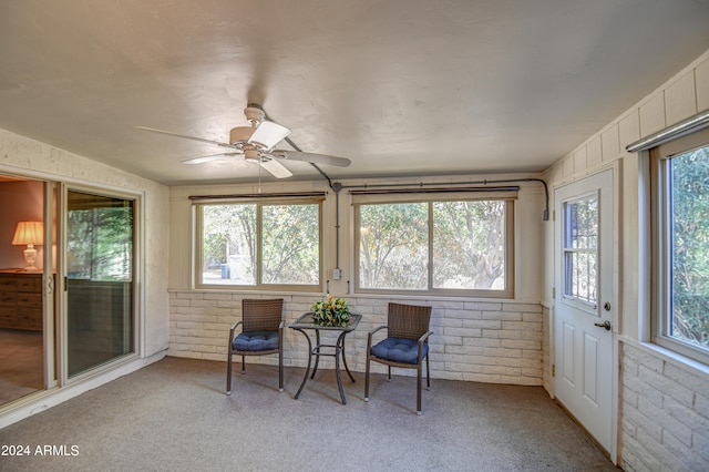 sunroom featuring a wealth of natural light and ceiling fan