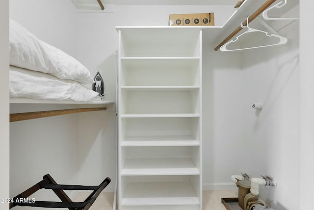 walk in closet featuring light tile patterned floors