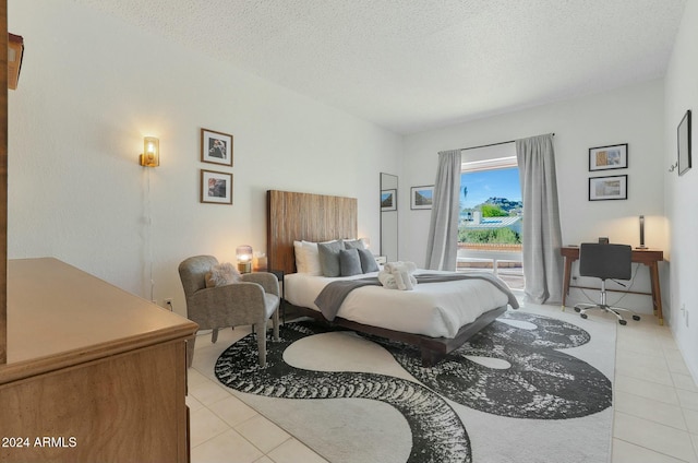 tiled bedroom with a textured ceiling