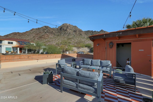 exterior space featuring a mountain view and an outdoor living space