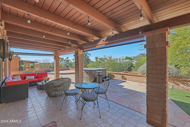 view of patio with an outdoor hangout area and a hot tub