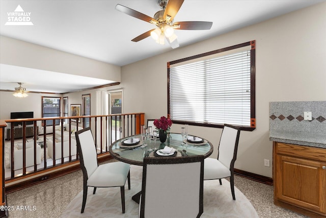 dining area featuring baseboards