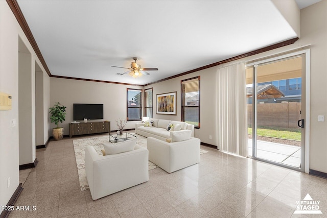 living area with crown molding, granite finish floor, and baseboards