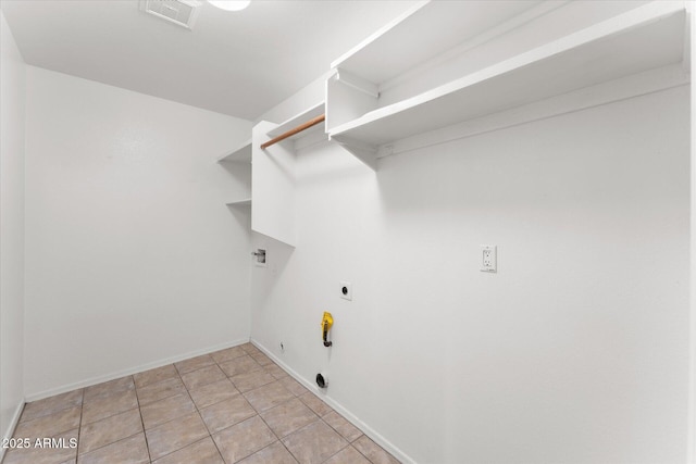 laundry room featuring hookup for a gas dryer, laundry area, visible vents, baseboards, and electric dryer hookup