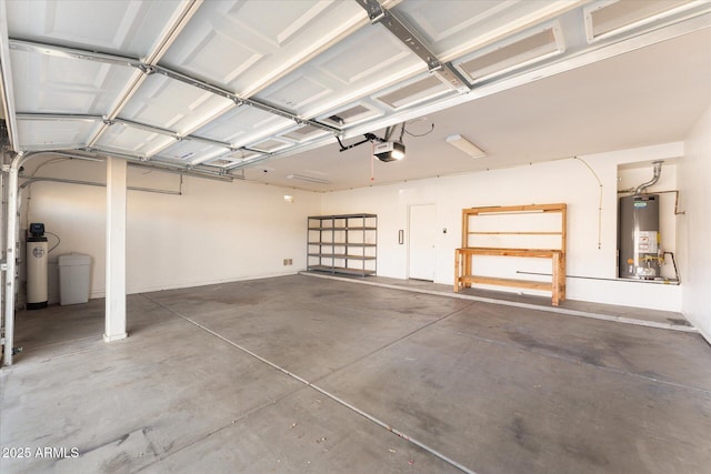 garage featuring gas water heater and a garage door opener