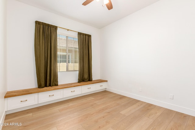 spare room featuring ceiling fan and light hardwood / wood-style floors