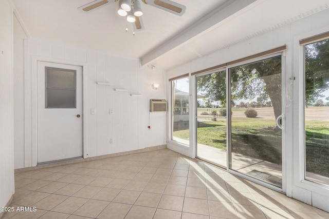 empty room featuring beamed ceiling, ceiling fan, light tile patterned flooring, and a wall mounted AC