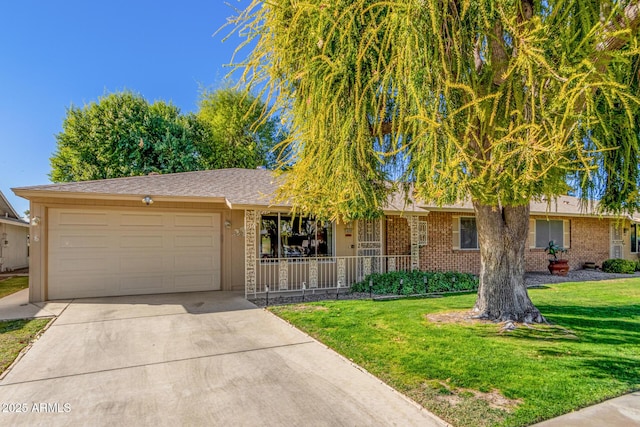 view of front of property with a garage and a front lawn