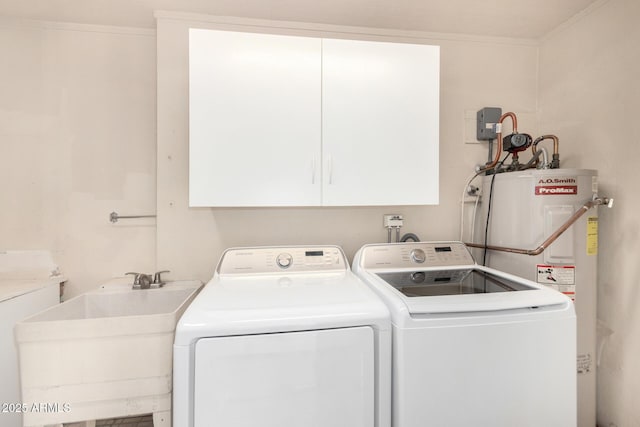 clothes washing area featuring sink, cabinets, gas water heater, separate washer and dryer, and crown molding