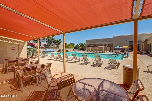 view of swimming pool featuring a patio